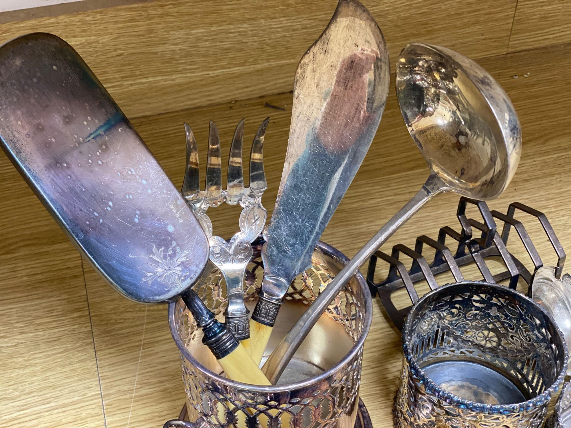 A quantity of plated items including coasters, flatware, cream jug, etc.